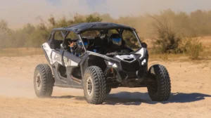 Can-Am Maverick X3 kicking up dust during extreme off road desert tour in Los Cabos